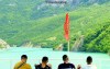 Four men on a boat at Lake Koman, Albania