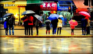 Pedestrians under umbrellas on Electric Avenue, Hong Kong
