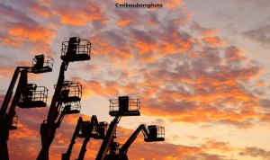 Cherrypickers at sunset in Salford