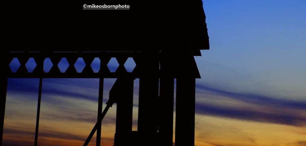 Dusk over Castlefield and silhouette of iron stairway