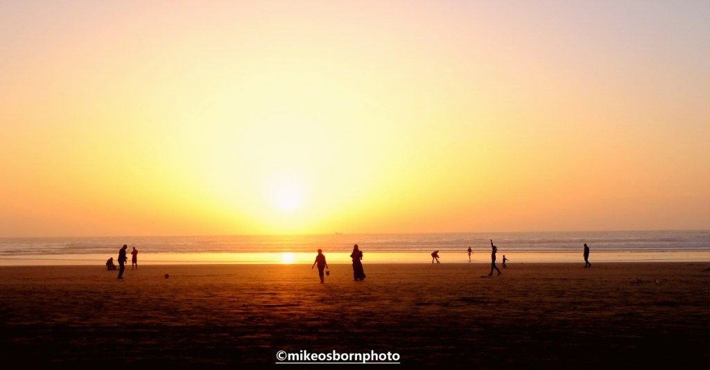 People on Agadir beach at sunset