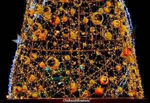 Christmas tree lit up at night in Manchester city centre.