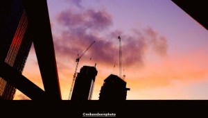 Manchester sunset frames skyscrapers under construction