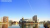 The Lowry Theatre and Salford Quays buildings reflected in the Manchester Ship Canal