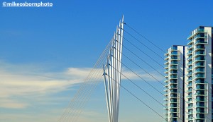 MediaCity footbridge and apartment blocks against a blue sky