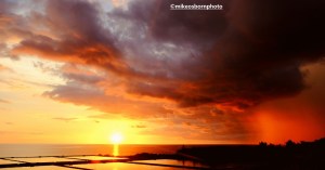 Dramatic sunset over a Cuban shrimp farm by the ocean