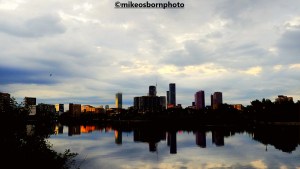 The skyline of new buildings in Manchester reflected in the Ship Canal