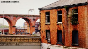 Derelict building and railway viaduct in Stockport
