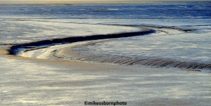 A deep channel in the sand in the Dee Estuary