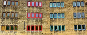 Colourful windows on a canalside building in Hebden Bridge