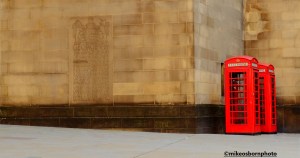 Two traditional red telephone boxes in St Peter's Square, Manchester