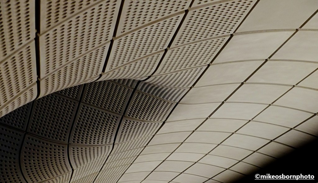 Curved concrete of an Elizabeth Line tunnel in London's Tottenham Court Road station