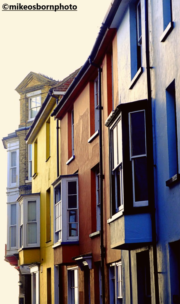 Brightly coloured buildings on a street in the Norfolk seaside resort of Cromer