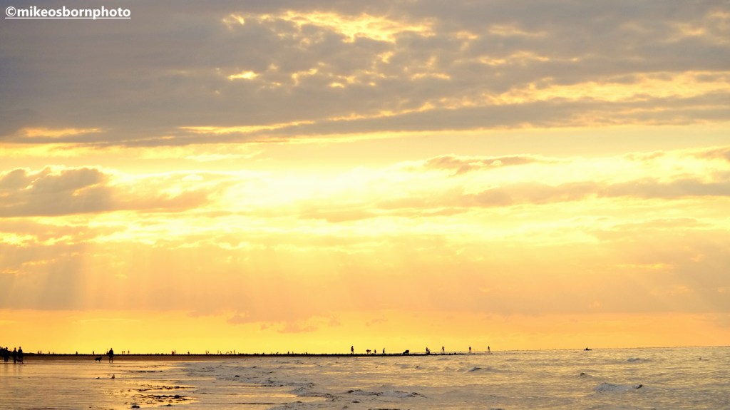 The orange glow of a summer dusk on Cromer beach, Norfolk, UK
