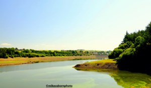 Low water levels in summer at Wayoh Reservoir, Lancashire, UK