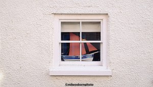 A model boat in a window in the Yorkshire seaside village of Staithes