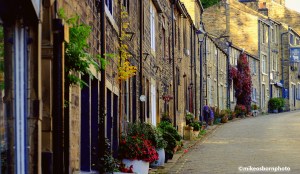 An uphill view of Main Street in Howarth, West Yorkshire in the UK
