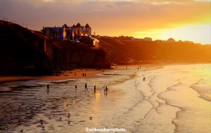 A golden dusk sheen basks Whitby Beach in North Yorkshire