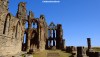 The ruins of Whitby Abbey in North Yorkshire against flawless bule skies