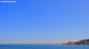 A minial, blue sky view of the tip of Runswick Bay in North Yorkshire