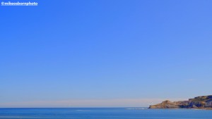 A minial, blue sky view of the tip of Runswick Bay in North Yorkshire