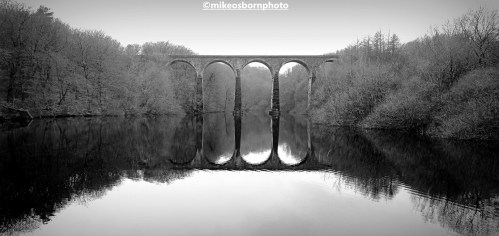 Railway viaduct at Entwistle Reservoir on a foggy winter's day