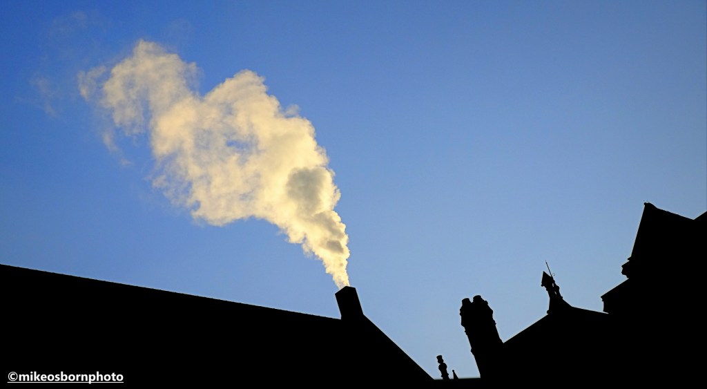A strong plume of steam coming from Manchester's Civic Centre buildings