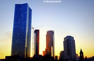 Tall buildings near Castlefield, Manchester bathed in a fiery winter's dusk