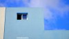 A blue wall and window of a house in Mosteiros, Fogo, Cape Verde