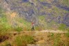 A woman carries glasses of juice to hikers at a mountain stop in Santo Antão, Cape Verde