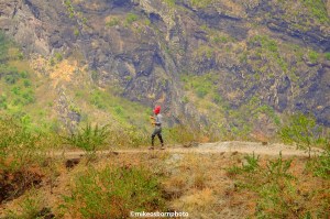 A woman carries glasses of juice to hikers at a mountain stop in Santo Antão, Cape Verde