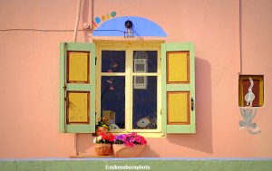 A quaint and colourful shop window in Finikas on the Greek island of Syros