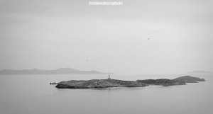 A view of Gaidouronissi lighthouse off the coast of Syros in the Greek islands