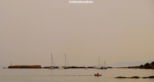 Boats moored on an overcast afternoon at Finikas on the Greek island of Syros
