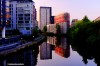 Apartment blocks along Manchester's River Irwell reflected perfectly