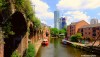 A view of old and new buildings along the Bridgewater Canal at Castlefield on a lovely summer's day