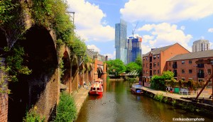 A view of old and new buildings along the Bridgewater Canal at Castlefield on a lovely summer's day