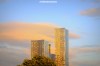 The towers of Manchester's Deansgate Square caught in the pink clouds of a summer dusk