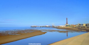 A view of the British seaside resort of Blackpool including its famous tower and North Pier.