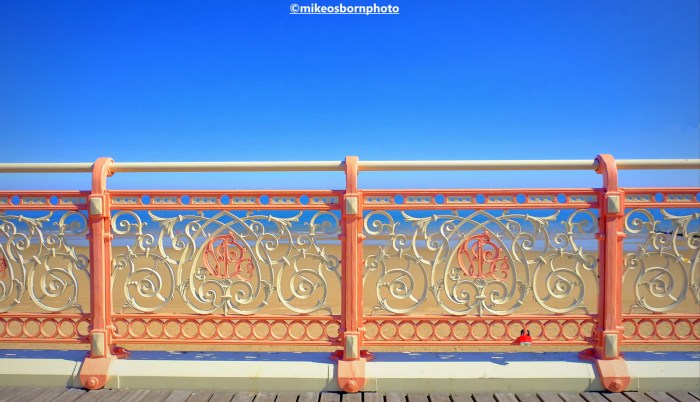 The pier's end at Colwyn Bay in Wales against a pure blue sky.