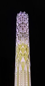 Manchester's Tower of Light illuminated in pink and yellow.