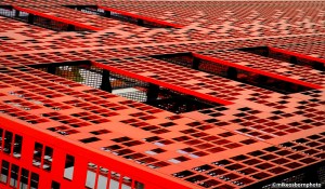 The red frontage of a new building close to Manchester's Oxford Road.