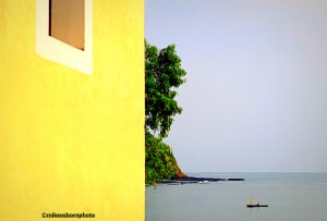 The yellow church of Santana overlooking the Atlantic Ocean in São Tomé island in Africa.