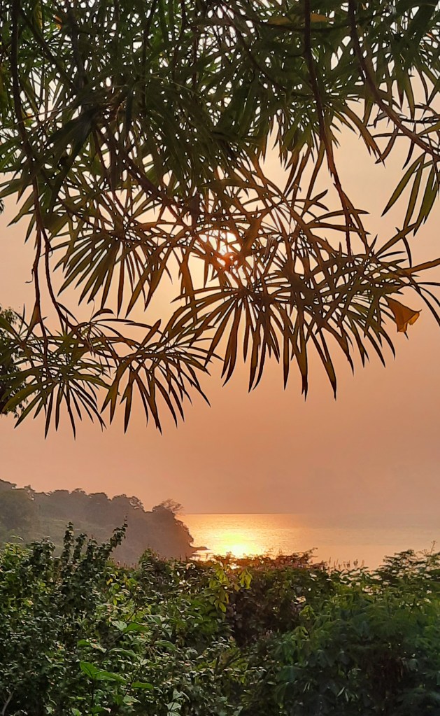 A golden dusk develops over Mucumbli lodge on the west coast of São Tomé.