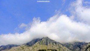 Cloud-topped mountains above the city of Kotor in Montenegro.
