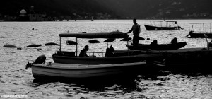 Boatsmen on the waterfront at Perast in Montenegro,