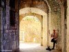 A street musician plays in one of the old tunnels of Kotor in Montenegro.