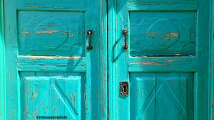 Shabby but stylish painted blue doors in the town of Montenegro, Perast.