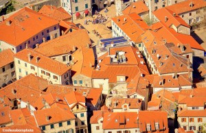A bird's eye view of the terracotta rooftops of Kotor old town in Montenegro.