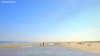 Beachgoers enjoy a warm summer's day on Hoek Van Holland Strand in the Netherlands.